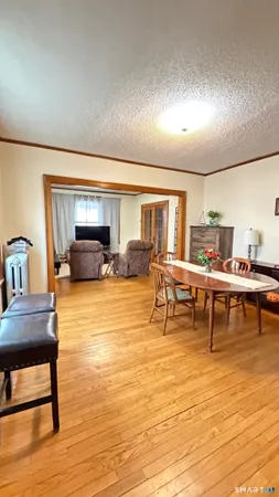 a large bedroom with a large bed and a night stand