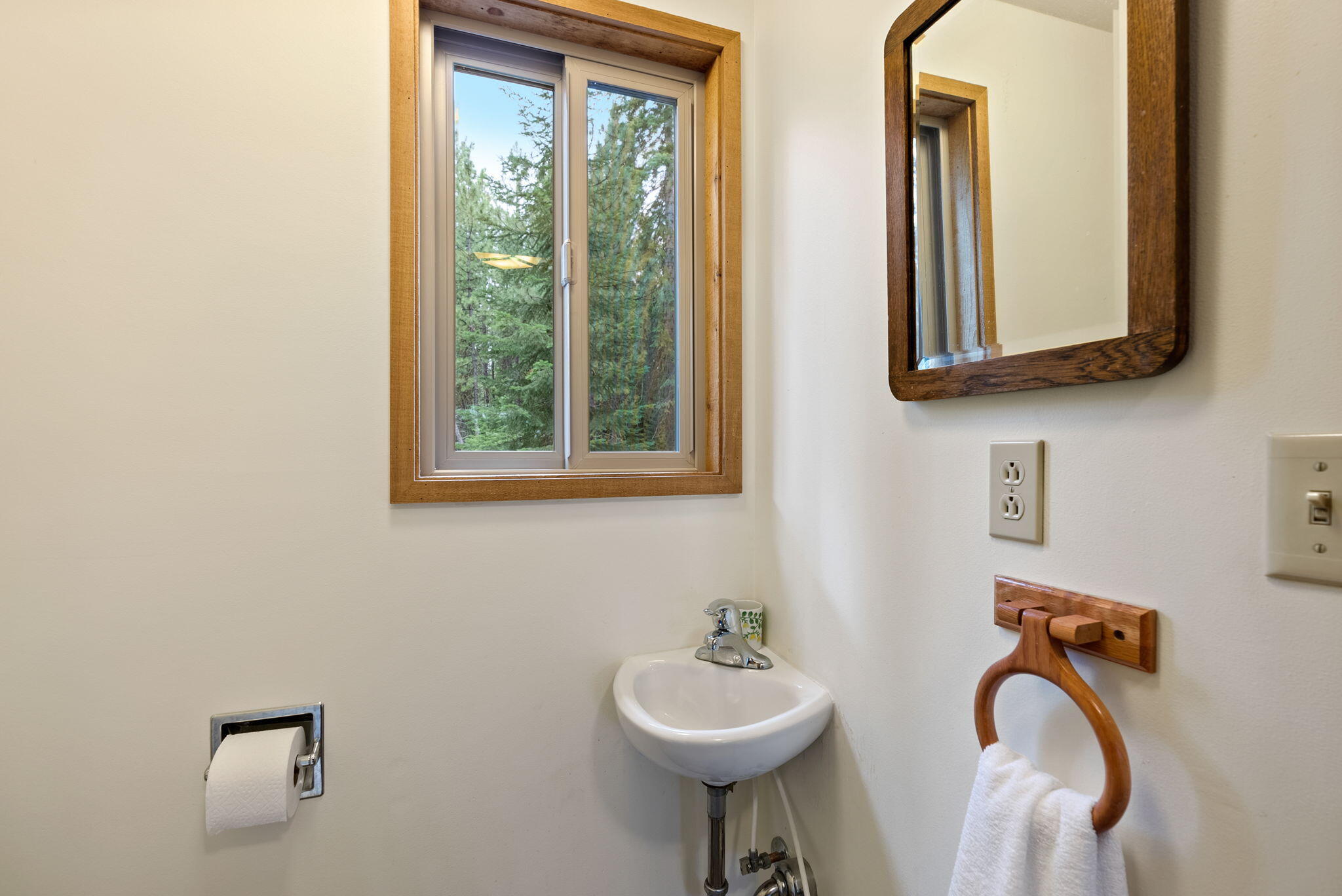 13251 Snowbrush, Unit GH 266 Black Butte Ranch, OR 97759 - Photo 14 of 37 a bathroom with a toilet sink and mirror
