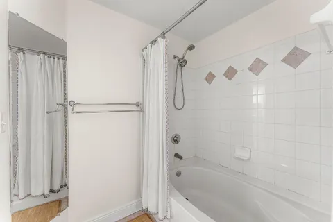 a room with gym equipment and windows