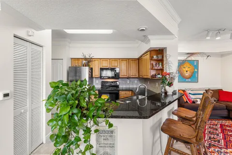 a kitchen with stainless steel appliances a refrigerator and a sink
