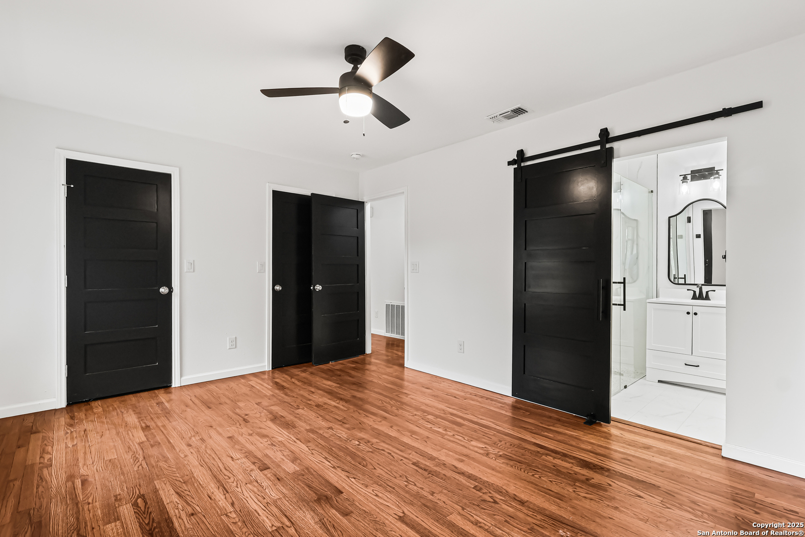 728 Rittiman Road San Antonio, TX 78209 - Photo 14 of 31 a view of empty room with wooden floor