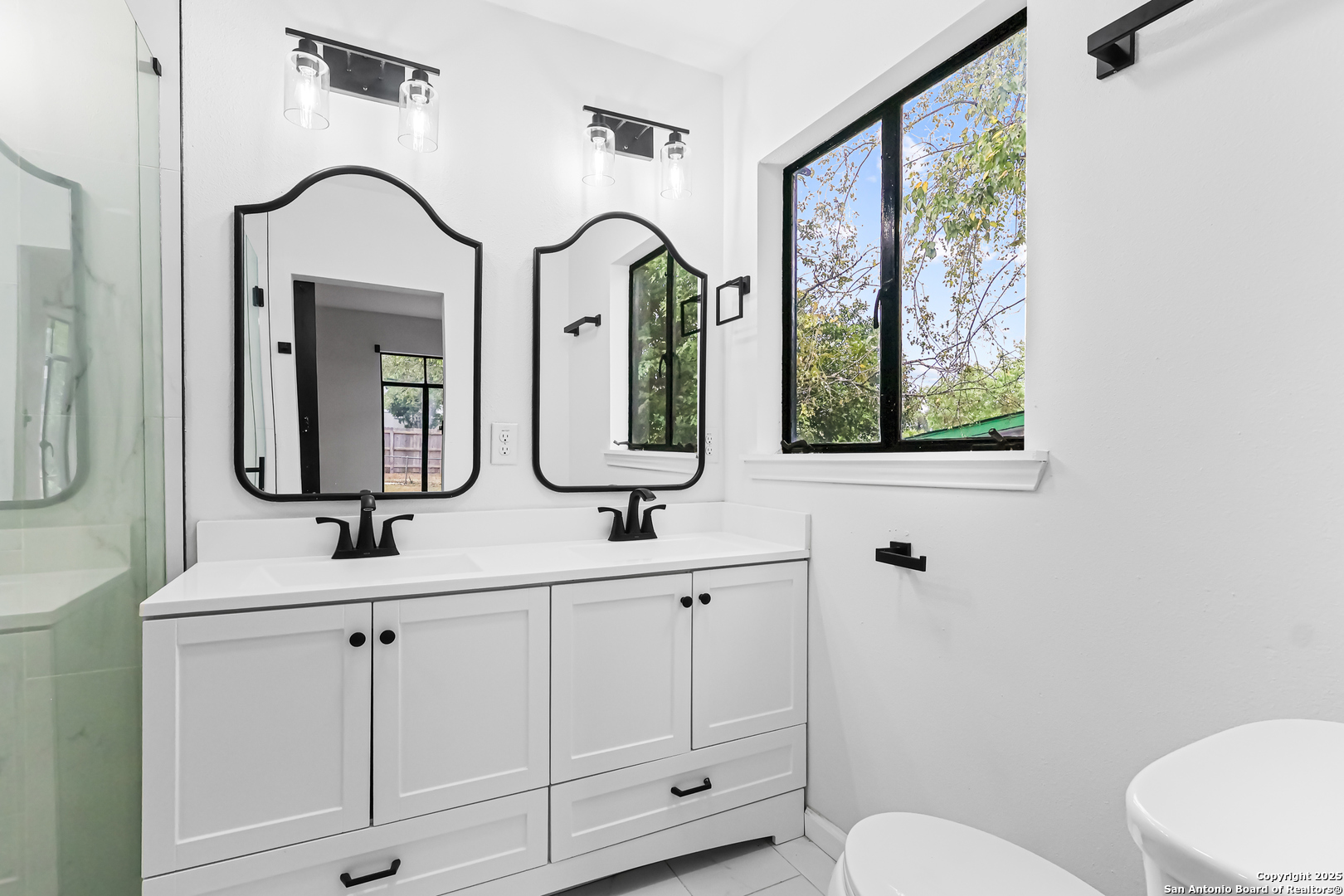 728 Rittiman Road San Antonio, TX 78209 - Photo 15 of 31 a bathroom with a double vanity sink mirror and toilet