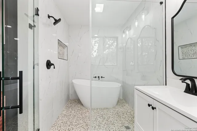 a bathroom with a bathtub and sink