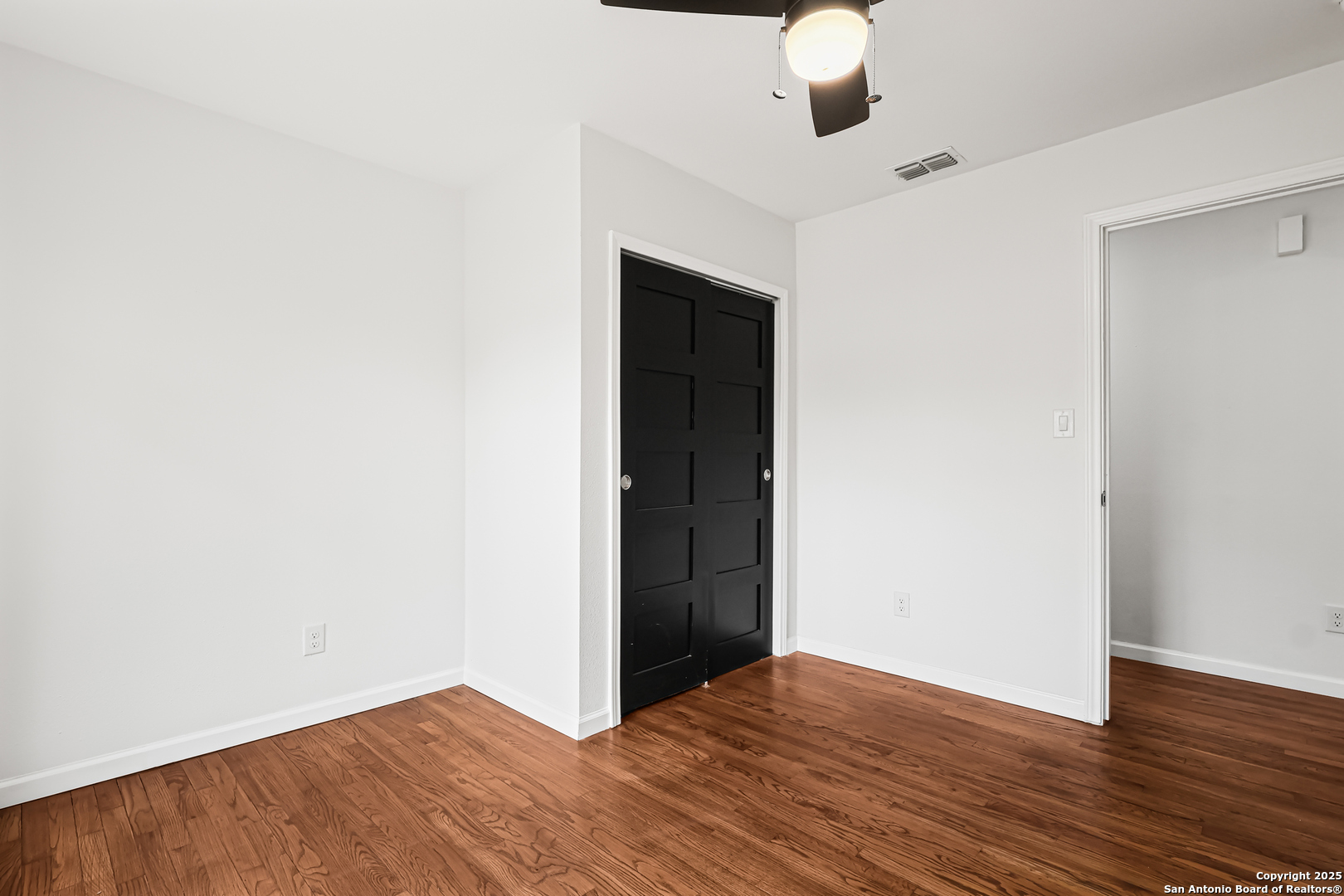728 Rittiman Road San Antonio, TX 78209 - Photo 18 of 31 a view of an empty room with wooden floor
