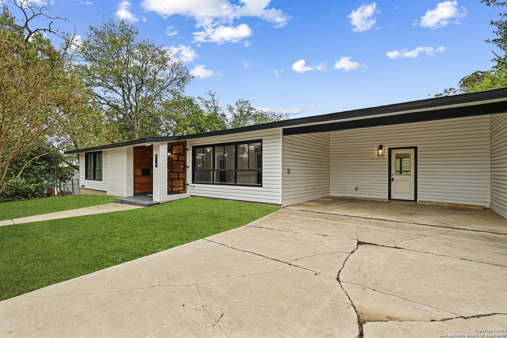 728 Rittiman Road San Antonio, TX 78209 - Photo 2 of 31 a backyard of a house with plants and garage