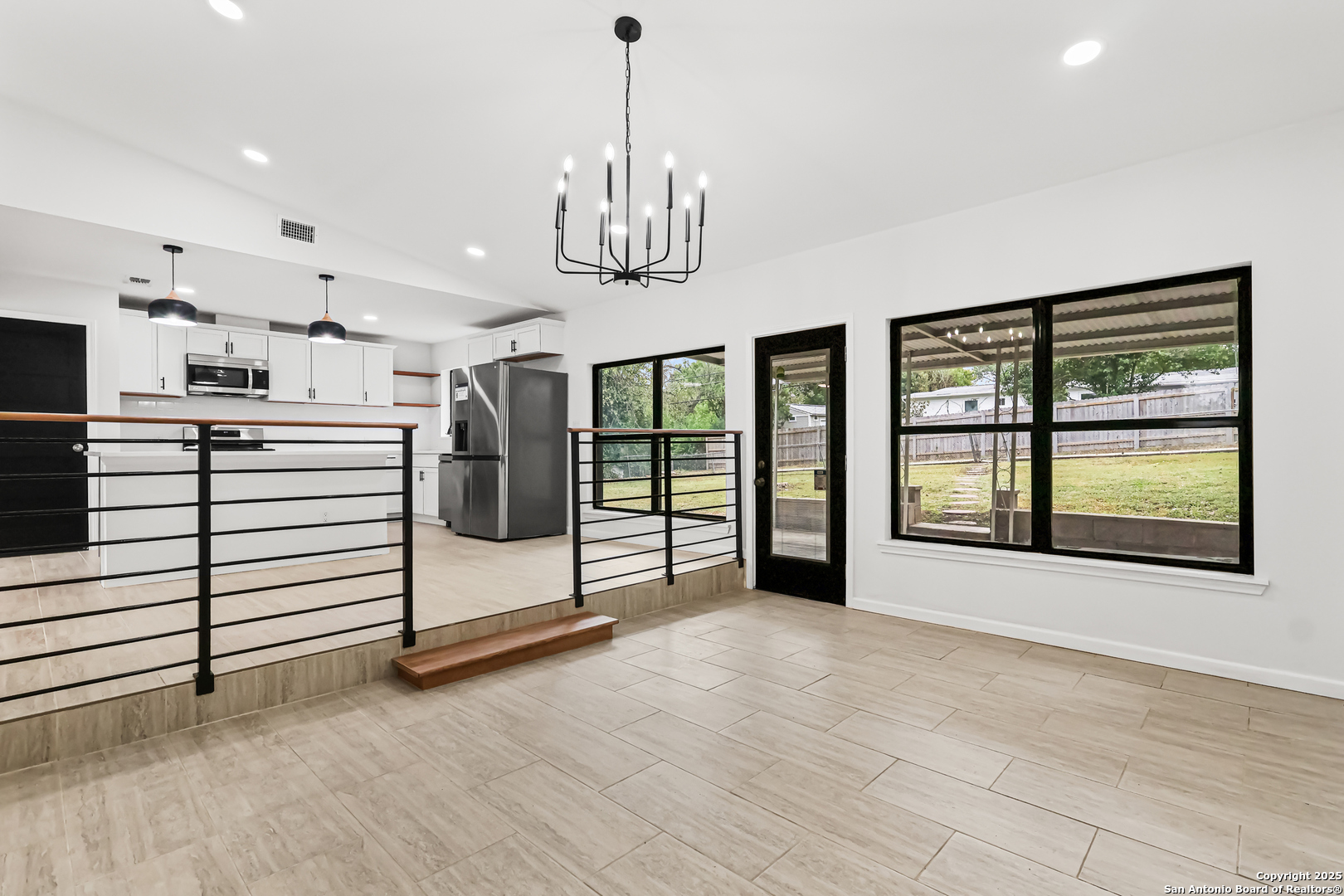 728 Rittiman Road San Antonio, TX 78209 - Photo 25 of 31 a view of an empty room with window and chandelier
