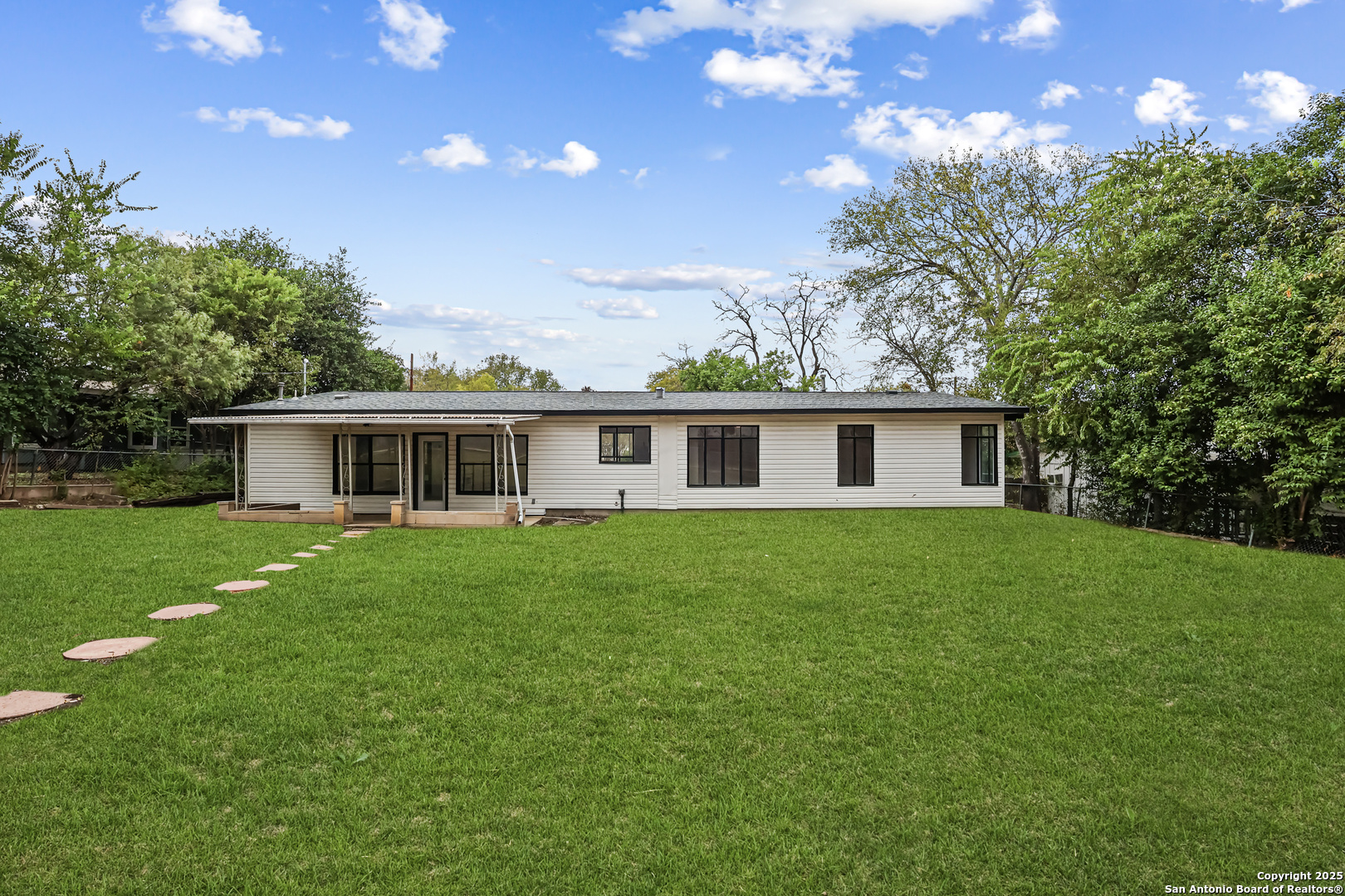 728 Rittiman Road San Antonio, TX 78209 - Photo 28 of 31 a front view of a house with a garden