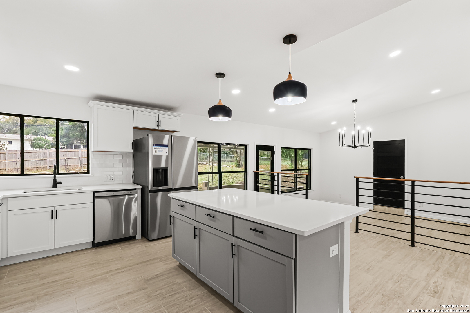 728 Rittiman Road San Antonio, TX 78209 - Photo 7 of 31 a large white kitchen with a window and refrigerator