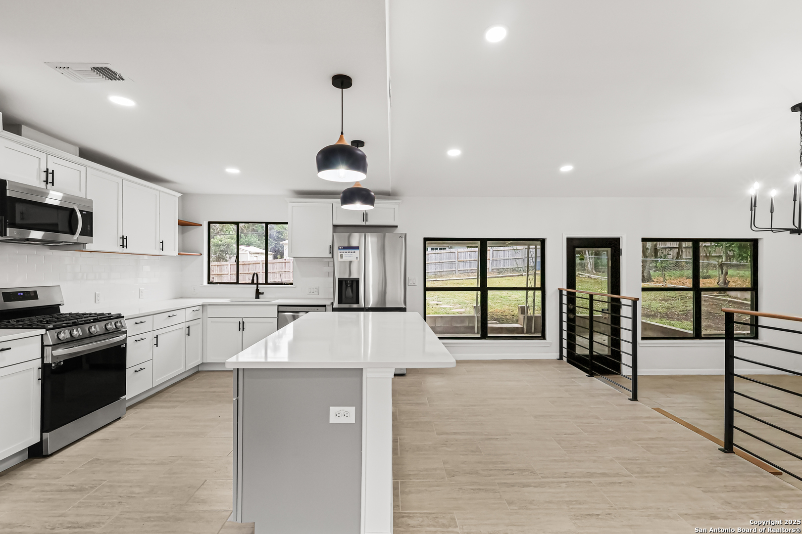 728 Rittiman Road San Antonio, TX 78209 - Photo 8 of 31 a large kitchen with stainless steel appliances kitchen island granite countertop a large kitchen island a stove and a sink