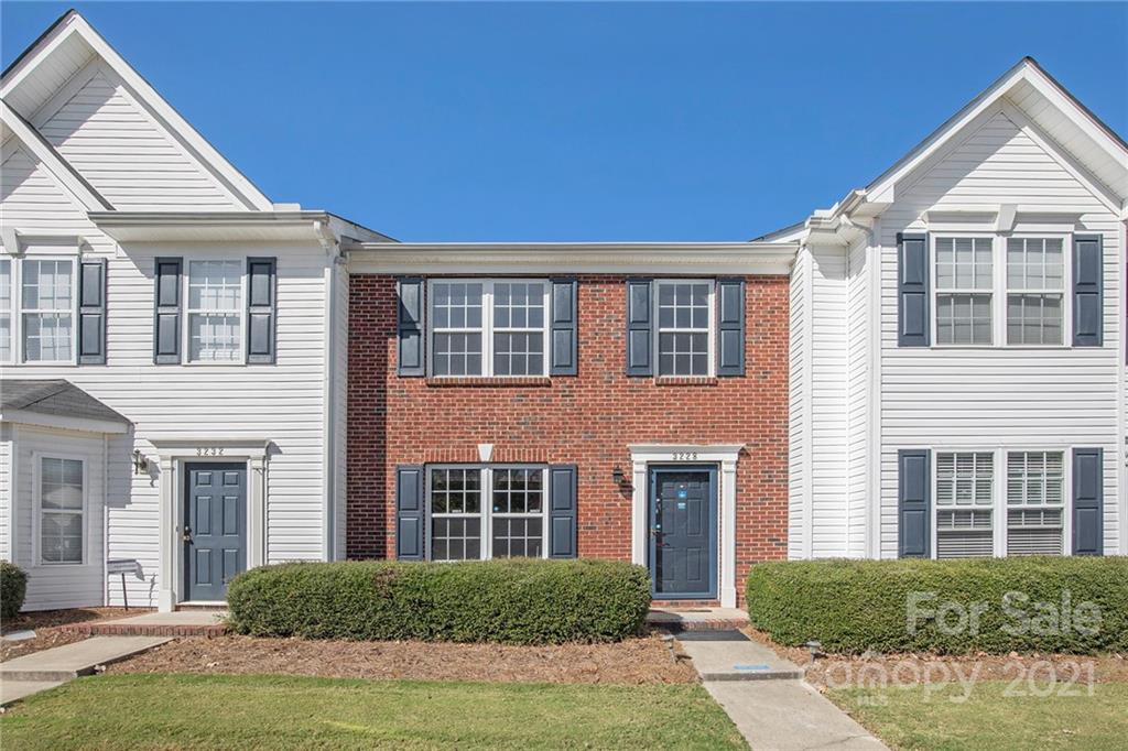 3228 Barons Court Road Charlotte, NC 28213 - Photo 1 of 19 a front view of a house with yard and green space