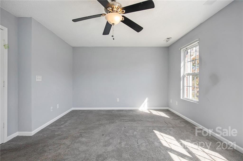 3228 Barons Court Road Charlotte, NC 28213 - Photo 14 of 19 wooden floor in an empty room with a window