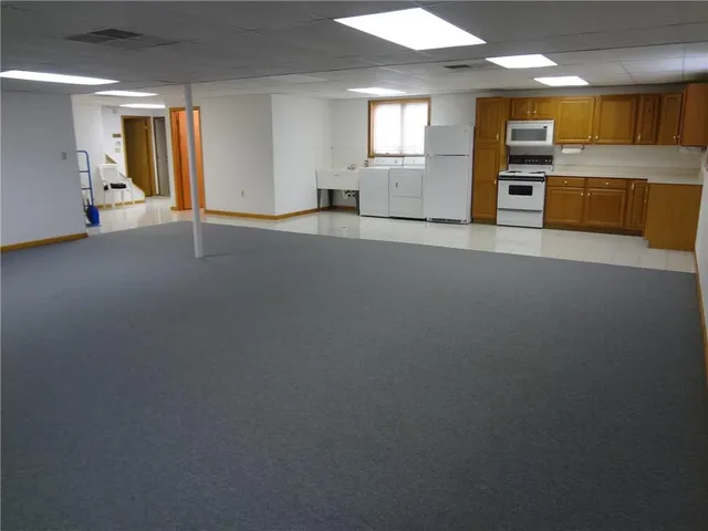a kitchen with a cabinets and a stove top oven