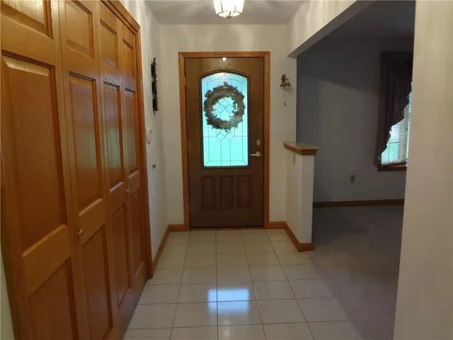 a kitchen with kitchen island granite countertop a stove a sink and a microwave