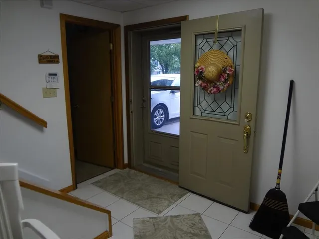 a front view of a house with a garden and garage