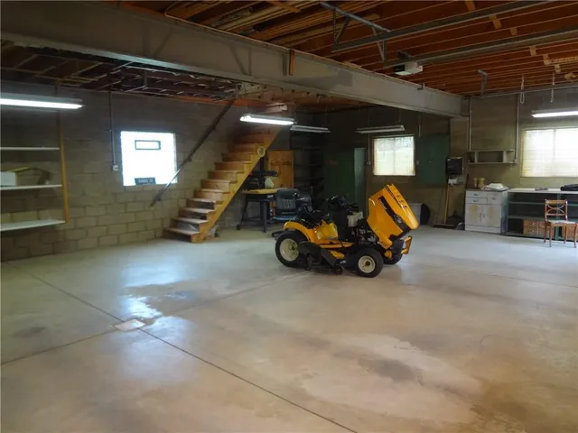 a view of an empty room with wooden walls