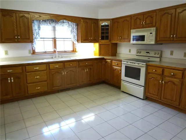 a kitchen with stainless steel appliances a refrigerator and a stove