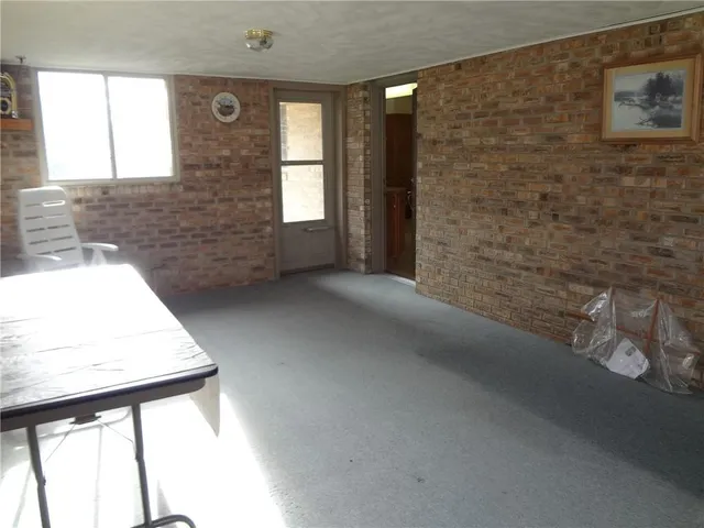 a view of a park with plants and a bench