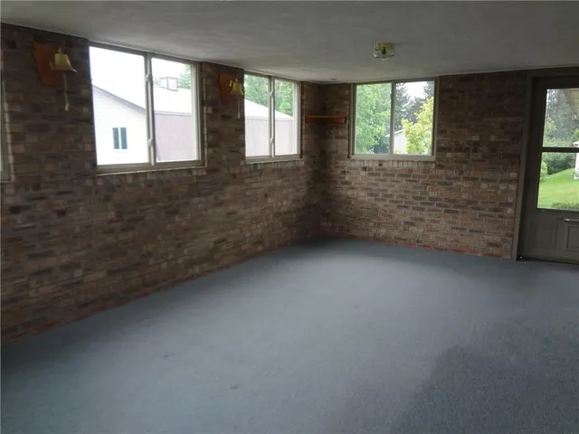 a view of kitchen with cabinets
