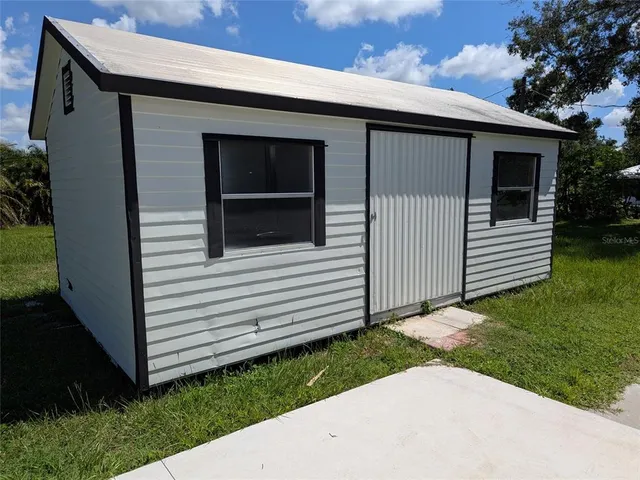 a view of a backyard with a garden