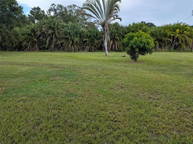 a kitchen with sink a refrigerator and a stove