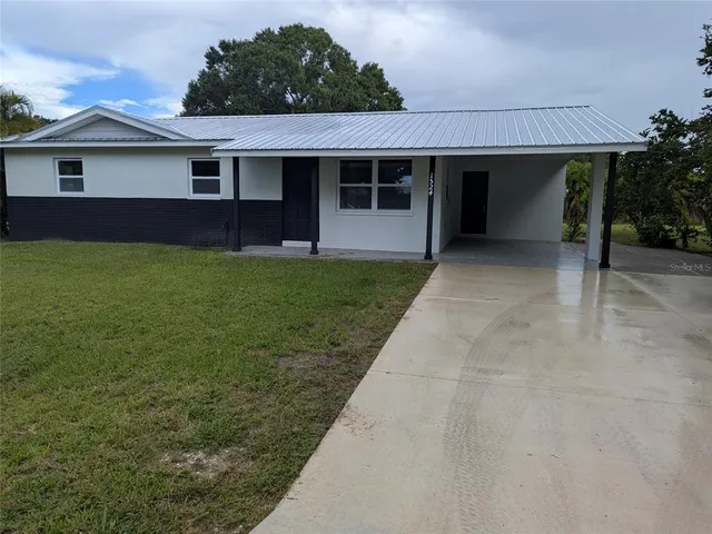 a view of a house with a garden