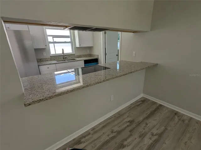 a view of a kitchen with a sink