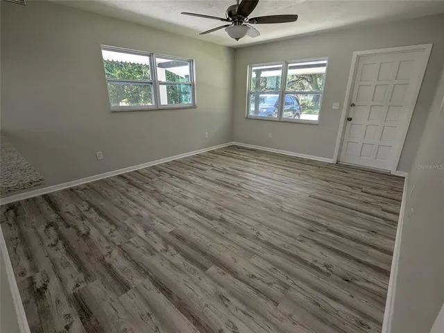 a view of an empty room with a window