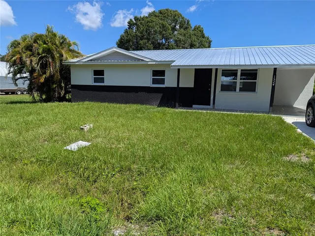 a house view with a garden space