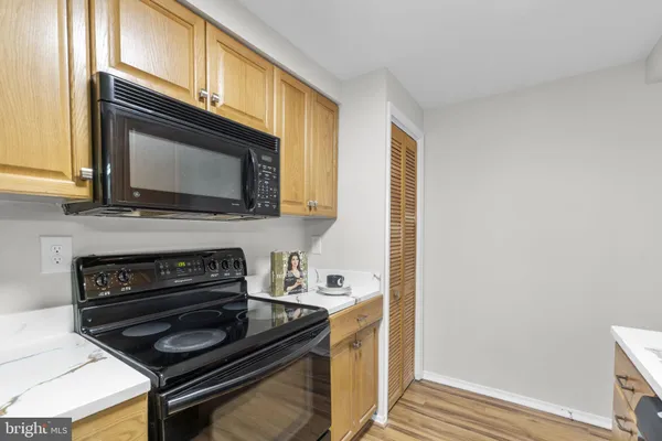 a kitchen with a stove and a microwave