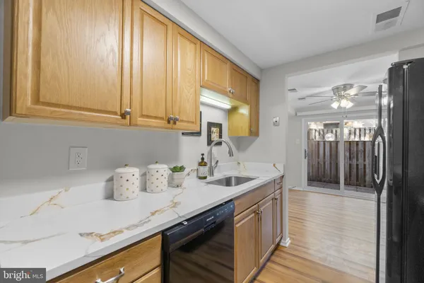 a kitchen with cabinets and window