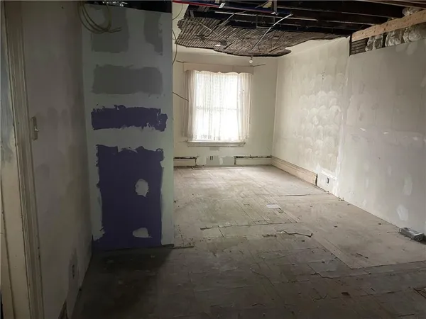 a view of a room with a barbeque grill and a window
