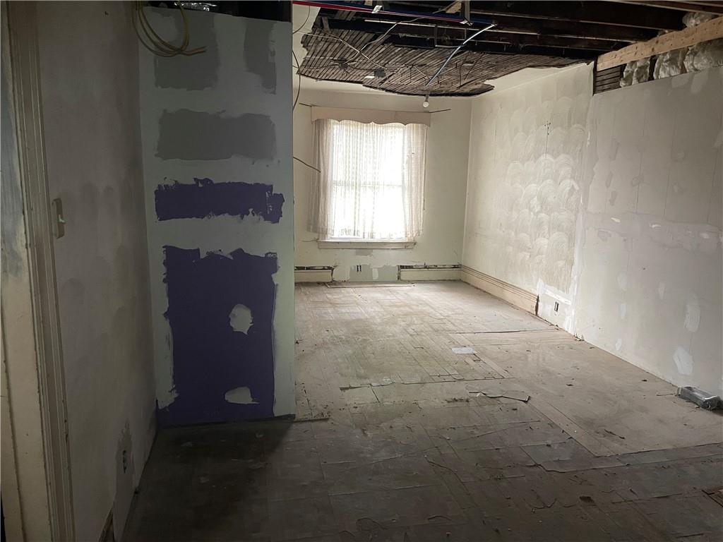 419 Robinson Street Pitcairn, PA 15140 - Photo 2 of 14 a view of a room with a barbeque grill and a window