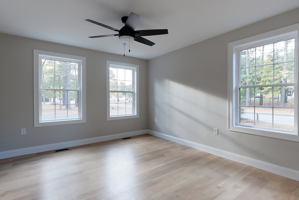 129 Lowell Road Pepperell, MA 01463 - Photo 11 of 39 wooden floor in an empty room with a window