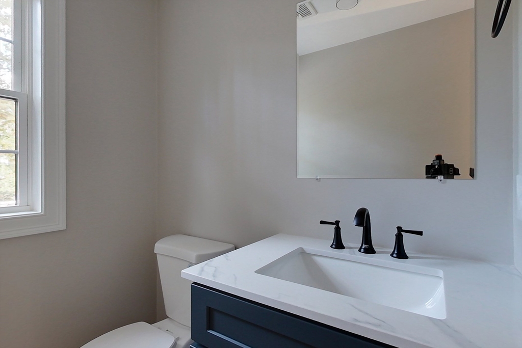 129 Lowell Road Pepperell, MA 01463 - Photo 16 of 39 a bathroom with a sink and a toilet