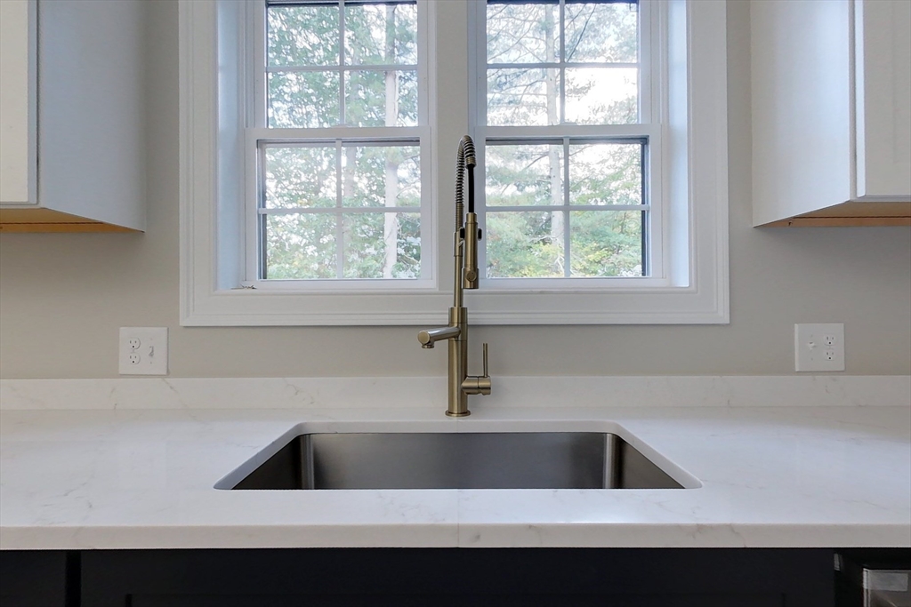 129 Lowell Road Pepperell, MA 01463 - Photo 3 of 39 a kitchen with a sink a vanity and window