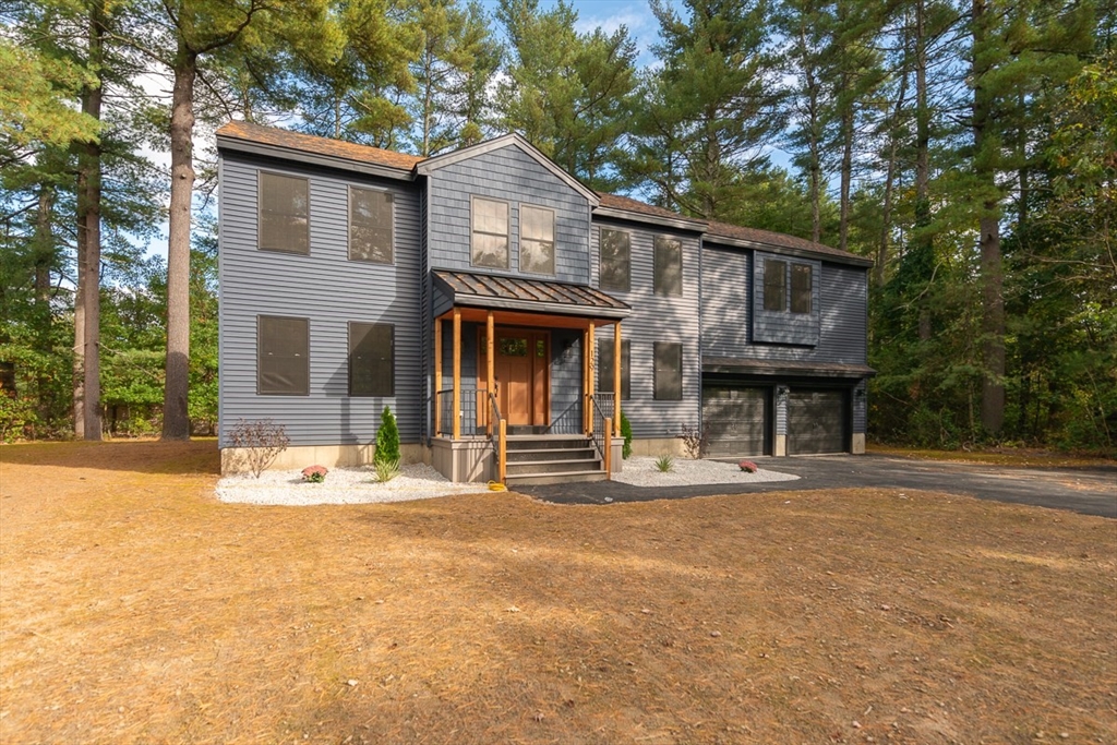 129 Lowell Road Pepperell, MA 01463 - Photo 31 of 39 a front view of a house with a porch