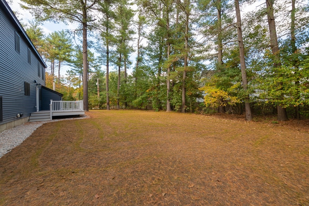 129 Lowell Road Pepperell, MA 01463 - Photo 35 of 39 a view of a house with a tree