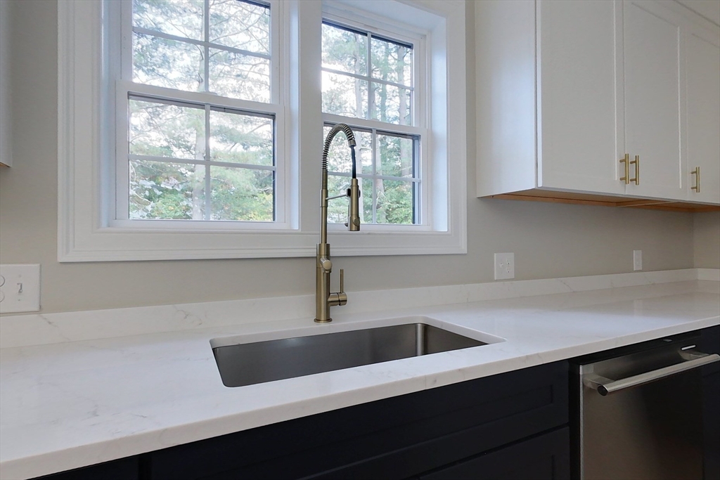 129 Lowell Road Pepperell, MA 01463 - Photo 4 of 39 a kitchen with a sink and large window