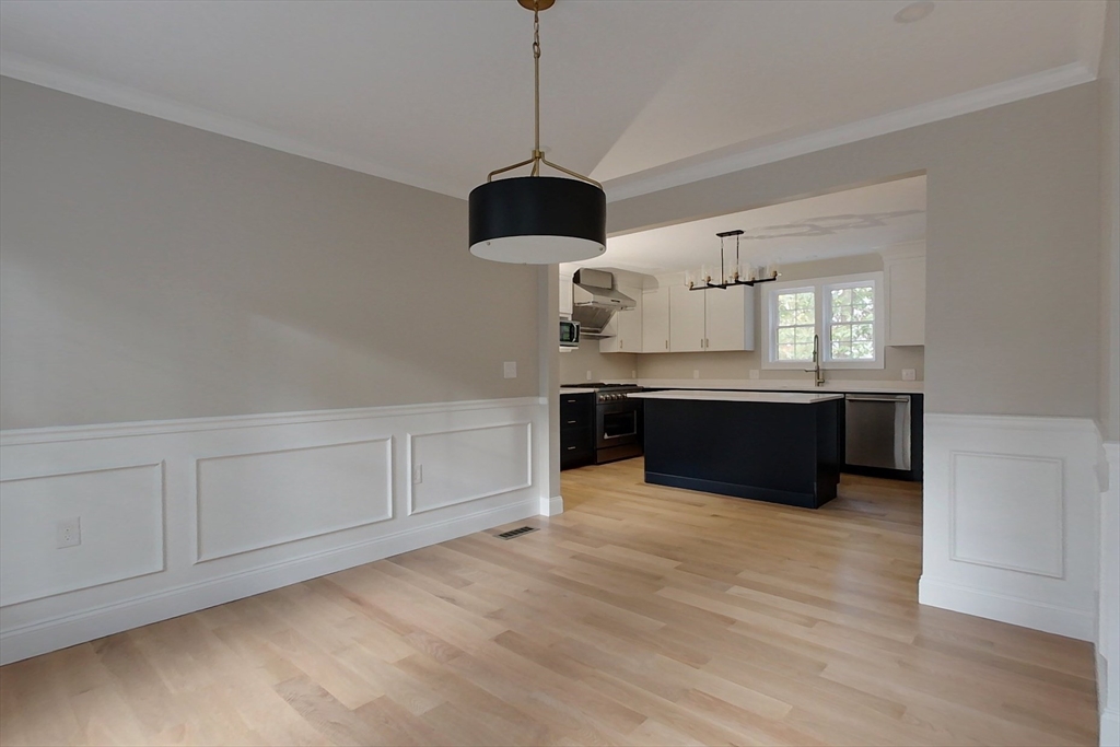 129 Lowell Road Pepperell, MA 01463 - Photo 7 of 39 a spacious kitchen with a sink and cabinets