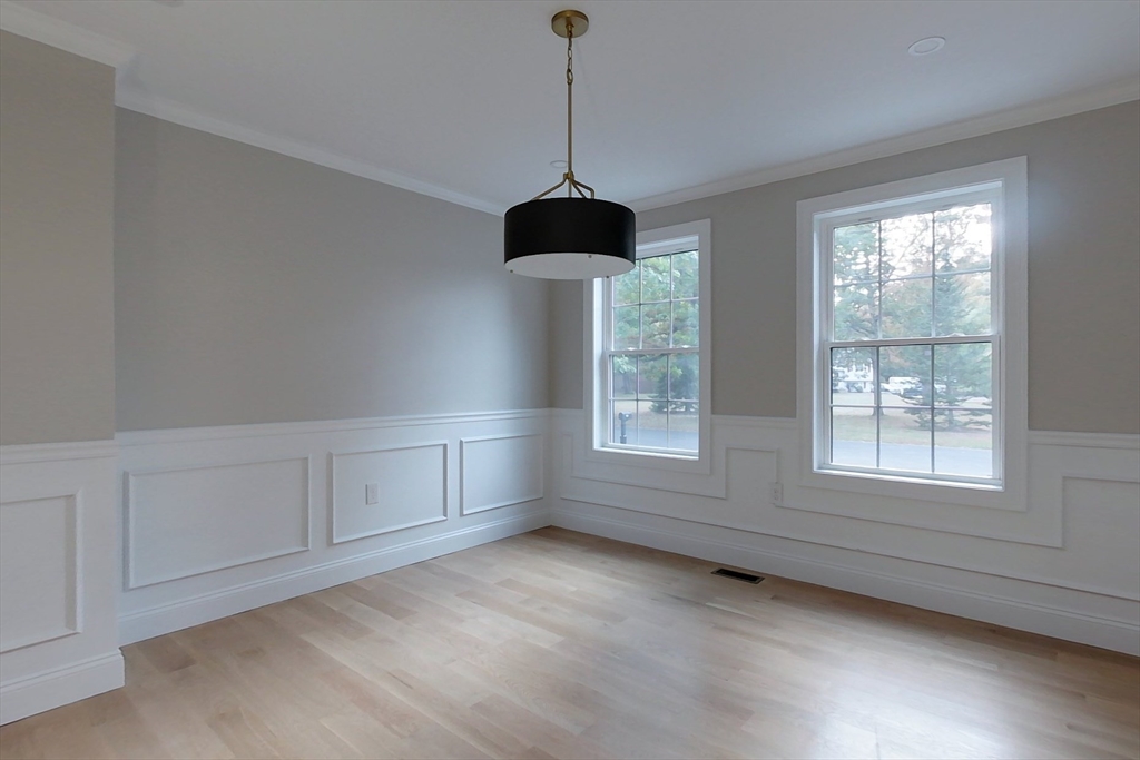 129 Lowell Road Pepperell, MA 01463 - Photo 9 of 39 wooden floor in an empty room with a window