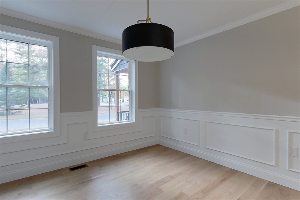 129 Lowell Road Pepperell, MA 01463 - Photo 10 of 39 a room with a chair and a window