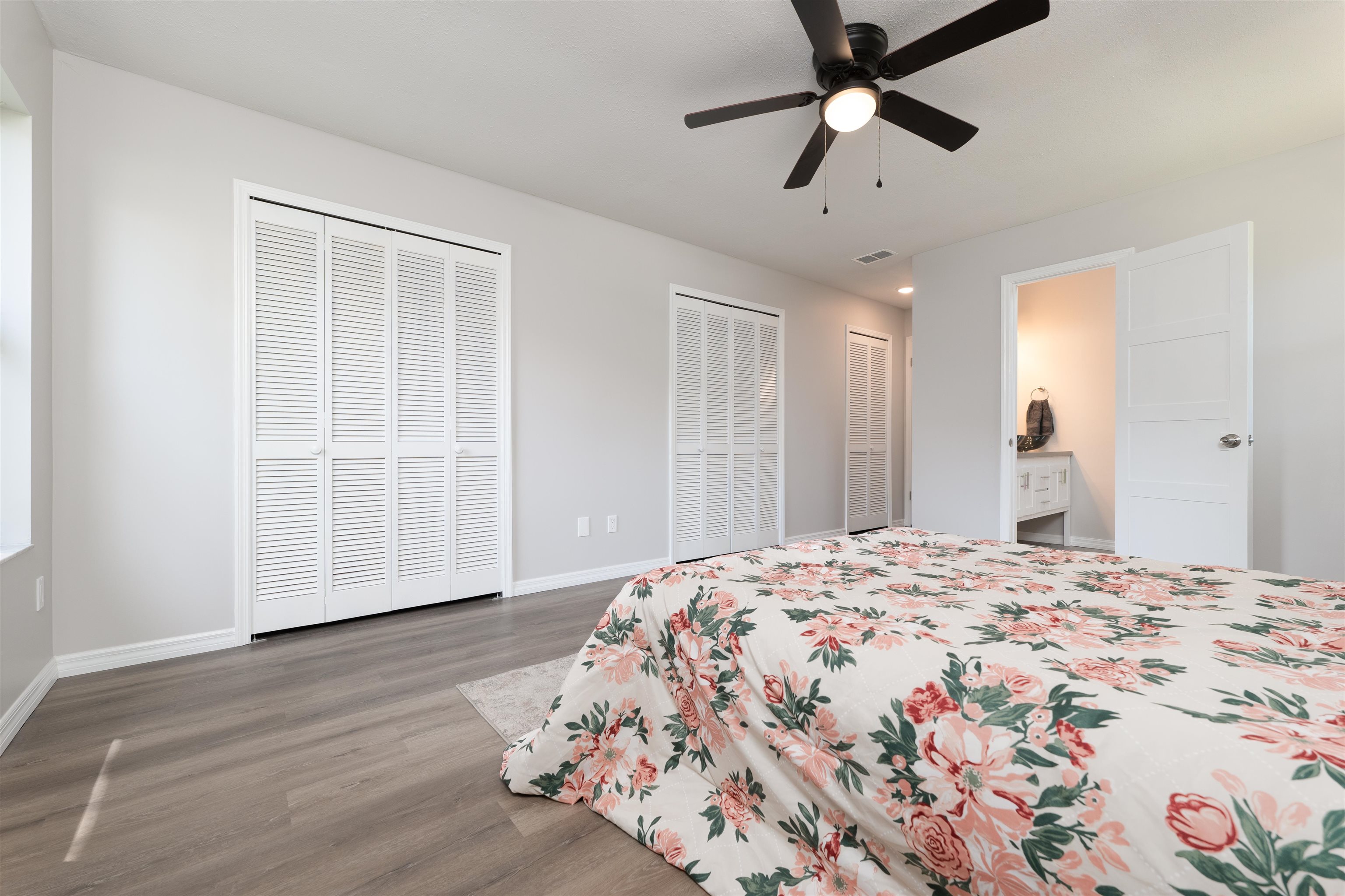 313 Cypress Road St. Augustine, FL 32086 - Photo 16 of 27 a bedroom with a large bed and a chandelier