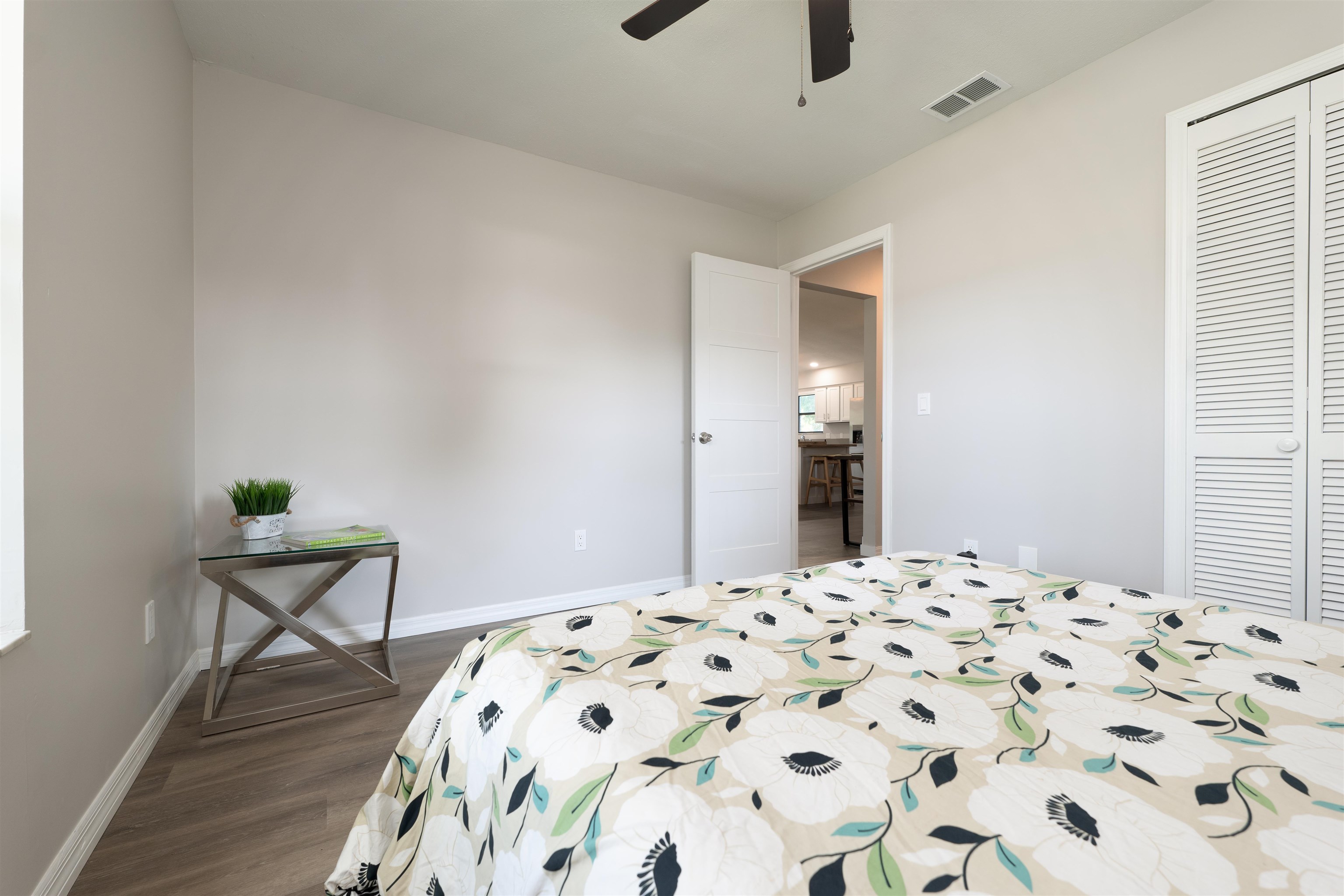 313 Cypress Road St. Augustine, FL 32086 - Photo 20 of 27 a bedroom with a bed and a table in it