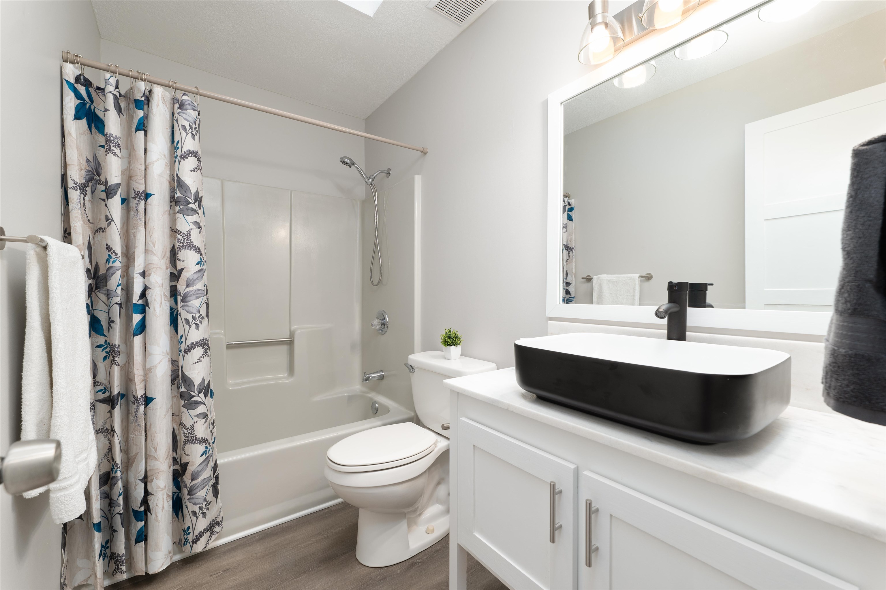 313 Cypress Road St. Augustine, FL 32086 - Photo 21 of 27 a bathroom with a double vanity sink toilet and shower