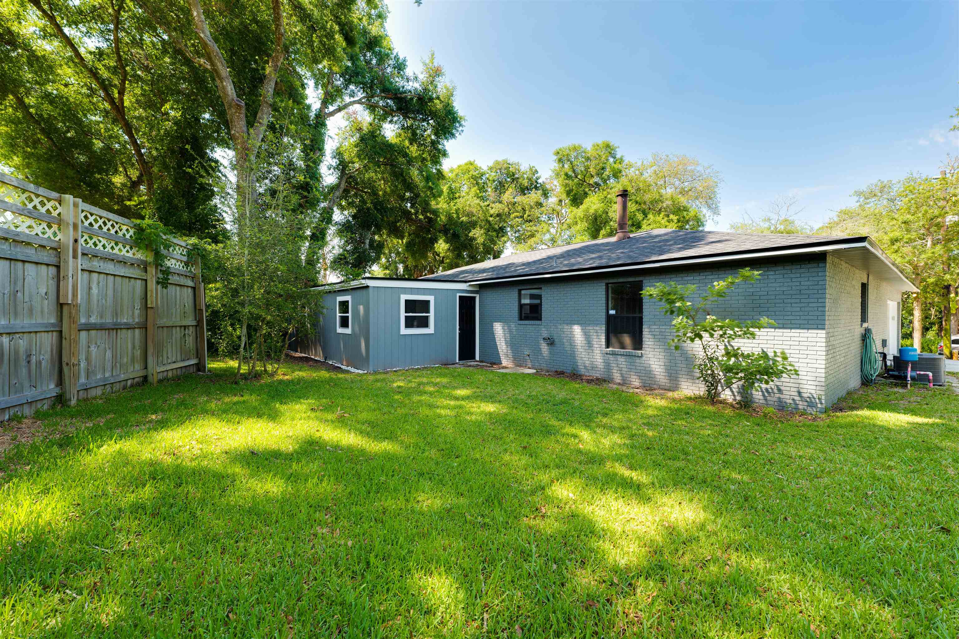 313 Cypress Road St. Augustine, FL 32086 - Photo 26 of 27 a view of a house with a yard