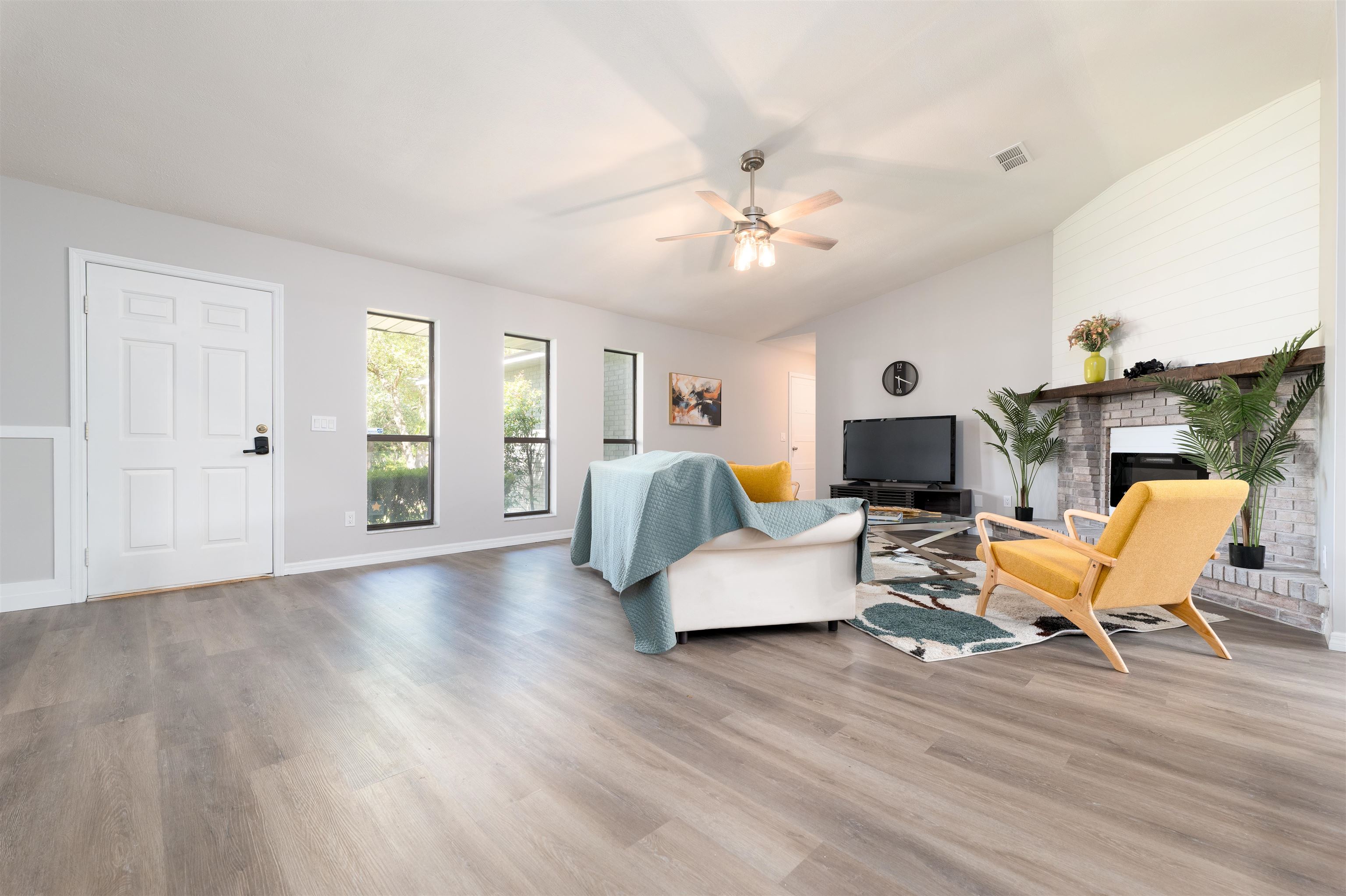 313 Cypress Road St. Augustine, FL 32086 - Photo 5 of 27 a living room with furniture or wooden floor and a ceiling fan