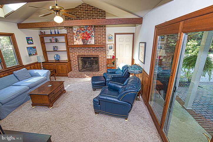 623 Douglas Road Salisbury, MD 21801 - Photo 25 of 64 Woodburning FP and door to garage and dr to patio