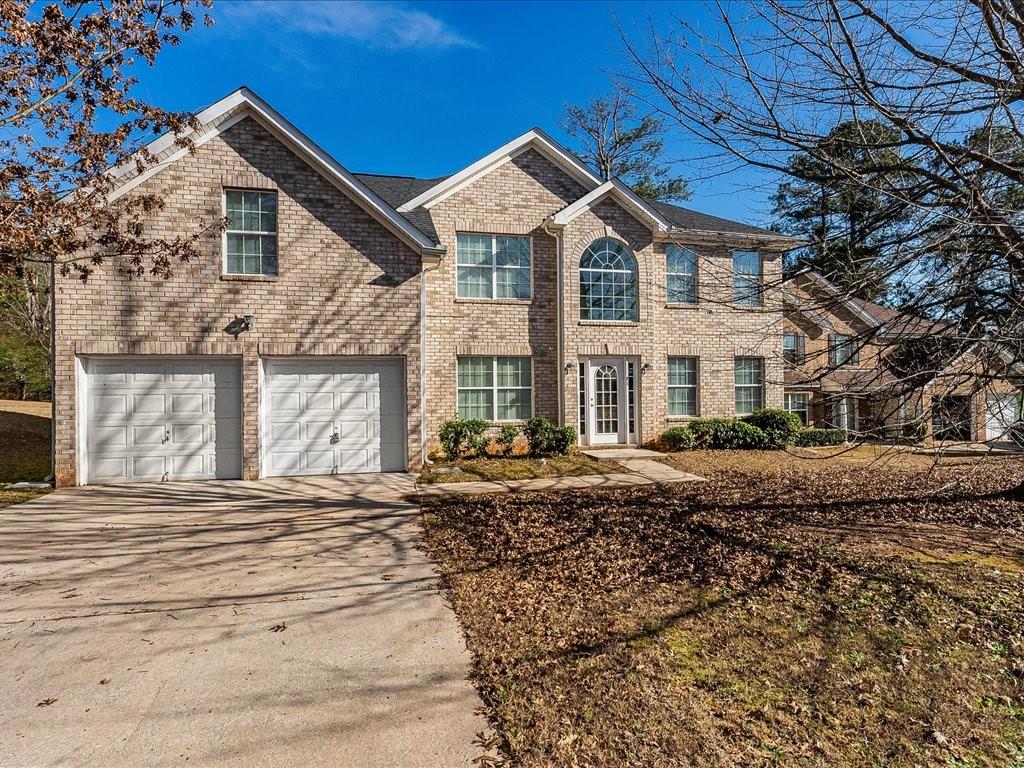 11950 Markham Way Hampton, GA 30228 - Photo 1 of 32 a front view of a house with a yard