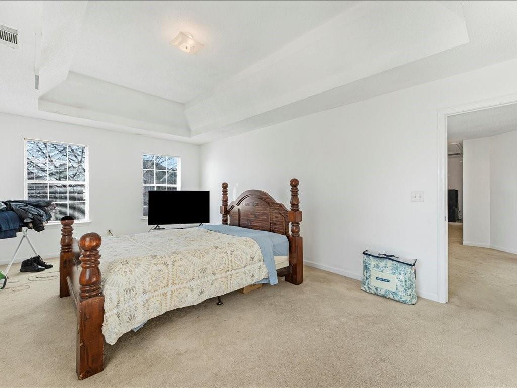 11950 Markham Way Hampton, GA 30228 - Photo 16 of 32 a bedroom with a bed and dresser