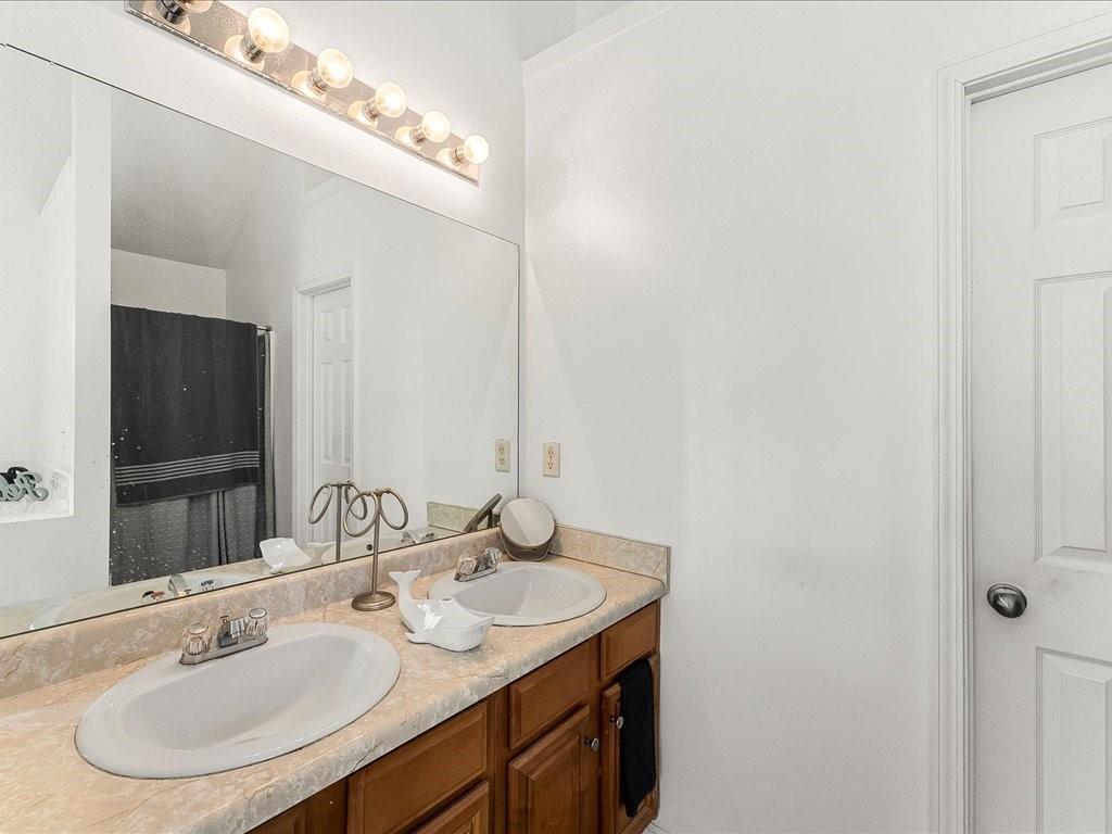 11950 Markham Way Hampton, GA 30228 - Photo 18 of 32 a bathroom with a sink and a mirror